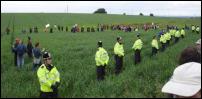 Indymedia Image: Police and public make strange lines
among GE crops (www.indymedia.org.uk)