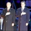 George
Bush and Mitt Romney with their hands on their hearts.