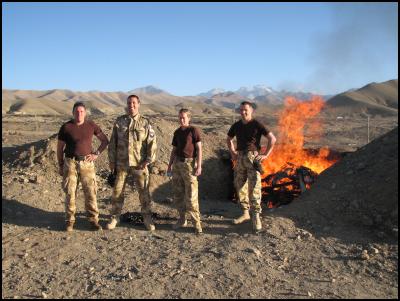 Left to right:
Sergeant Nick Bunker, Major Phillip Misur, Lance Corporal
Chantelle Locke and Staff Sergeant Tony Laing with burning
pit in background