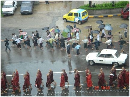 Monks marched past the
headquarters of the Burmese National League for
Democracy