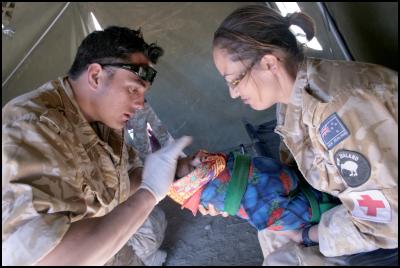 New Zealand medics
Lance Corporal Luke Tamatea (Royal New Zealand Infantry
Regiment) and Sergeant Jo Walters (Royal New Zealand
Airforce) treat a baby in Afghanistan