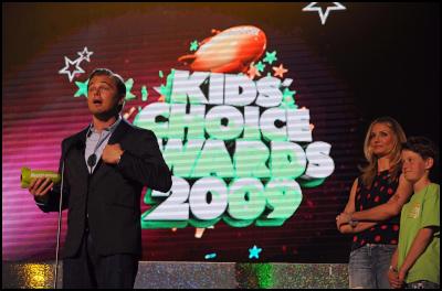 Leonardo DiCaprio
accepts the Big Green Help Award at the 22nd Annual Kids'
Choice Awards as Cameron Diaz watches on Saturday, March 28,
2009, in Los Angeles. (Katy Winn/AP Images for
Nickelodeon)