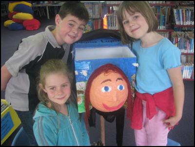 Kaurilands Primary
School pupils from left, Katie Thompson, 6, Robert Collins 7
and Bronwyn Rhodes, 5, with one of the school’s winning
letterboxes
