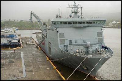 The HMNZS
CANTERBURY berthed at Apia, offloading supplies using her
crane. 