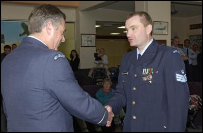 F/S Andrew Forster
being presented with the NZ Operational Service Medal (Left)
and NZ General Service Medal Afghanistan (Right) by Air Vice
Marshal Graham Lintott, Chief of Air
Force.