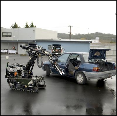 Robot prepares to
conduct a search of a vehicle.