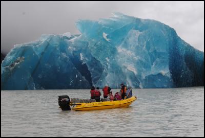 Mark Bascand from Glacier Explorers shows astounded passengers one of the many icebergs that calved into Tasman Lake today as a result of the earthquake.