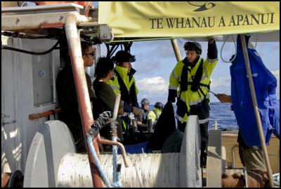 Tuesday, April 12,
2011. Police warn crew members of San Pietro about
approaching within set distances of the seismic survey ship
Orient Explorer after boarding the te Whanau a Apanui owned
fishing vessel off East Cape today. The San Pietro is part
of the flotilla opposing deep sea oil drilling.