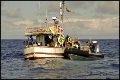 Tuesday, April 12,
2011. Police board the te Whanau a Apanui owned fishing
vessel, San Pietro, off East Cape today to warn crew about
approaching within set distances of the seismic survey ship
Orient Explorer. The San Pietro is part of the flotilla
opposing deep sea oil drilling.