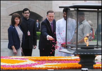 The Prime Minister
of New Zealand, Mr. John Key paying floral tributes at the
Samadhi of Mahatma Gandhi, at Rajghat, in Delhi on June 28,
2011. Mrs. Bronagh Key is also seen. Photo credit:  PIB &
Bharat-Darshan, Hindi magazine from New Zealand