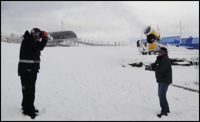 Coronet Peak ski
area manager Hamish McCrostie throws a snowball at
snowmaking head of department Pete Deuart
