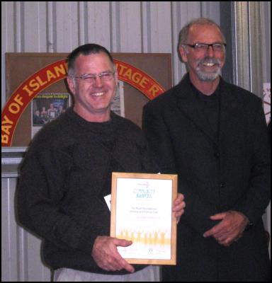 William recieving a Trustpower community award for conservation as President of the Far North Hunting and fishing club  this year presented by Far north mayor, Wayne Brown