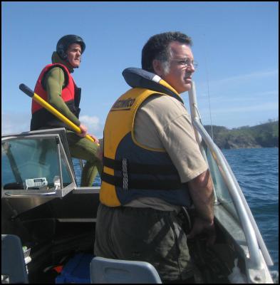 William (front) skippering the DOC boat helping to disentangle a humpback whale with DOC staff member Mike Morrissey 