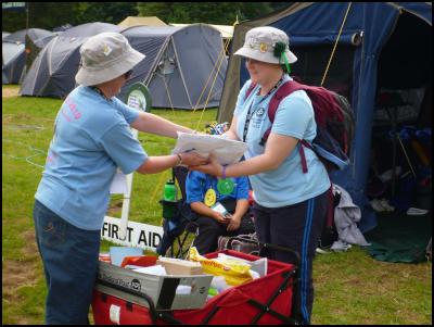 Debbie and one of
the Guides delivering mail around the Tui 12
camp.