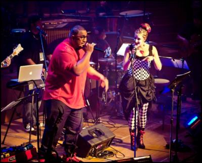Lui Fauolo (L) and
Tamsyn Miller (R) perform at Remix the Orchestra: Full
Orchestra Meets Hip-Hop. Auckland Town Hall, 31 May 2012.
Image by Oliver Rosser.