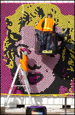 Reproducing a giant
version of Andy Warhol’s most famous image of a celebrity
is no mean feat, especially when it involves almost 4,000
testpots. Paint company Resene is doing its bit for Art Week
in Auckland’s BIG little City by recreating Warhol’s
iconic image of Marilyn Monroe, widely considered to be one
of the most influential pieces of modern art of all
time.