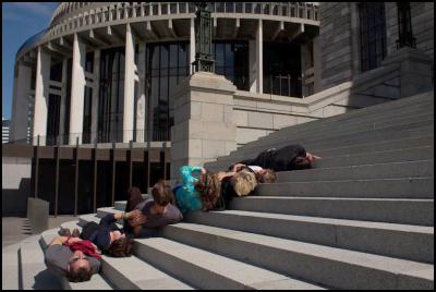 from Mark
Harvey’s Productive Bodies, March 2012. Image by Gabrielle
McKone. People lying on the steps of the Beehive.