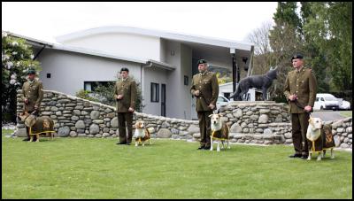 Defence Force dog
handlers with their dogs, graduate from NZ Defence Force's
first explosive detection dog course.