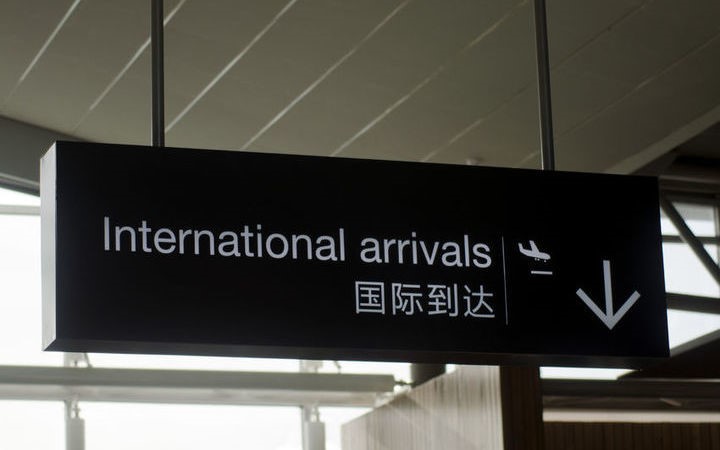 the sign for
Internation Arrivals at an Airport