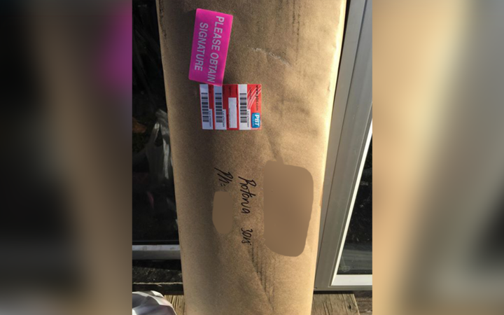 A PBT Couriers
driver left this package, with a gun inside, leaning next to
the front door because no one was home. Photo: SUPPLIED