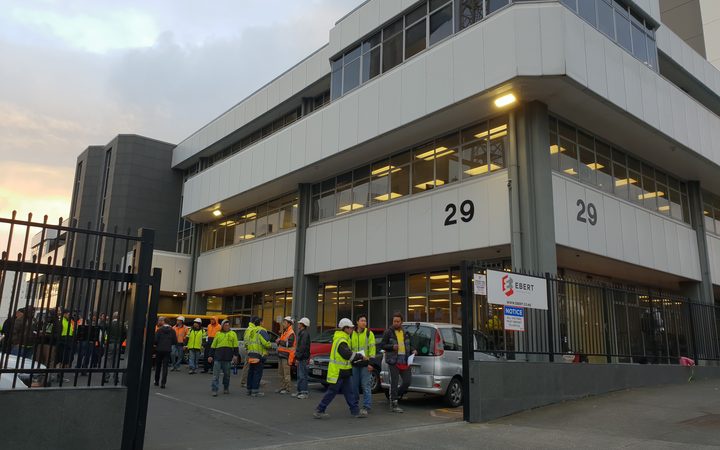 Workers and
contractors were locked out of the Ebert Construction's
Union Green apartment site in Auckland. Photo: RNZ 