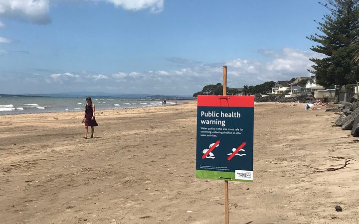 beach with public
health warning sign