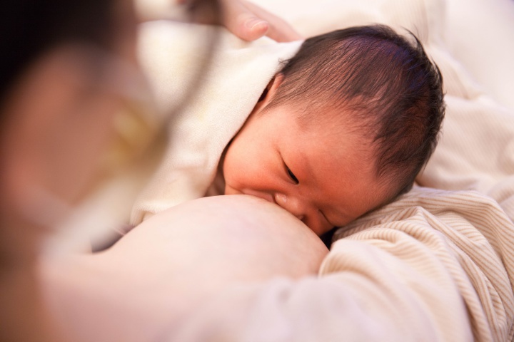 a baby,
breastfeeding