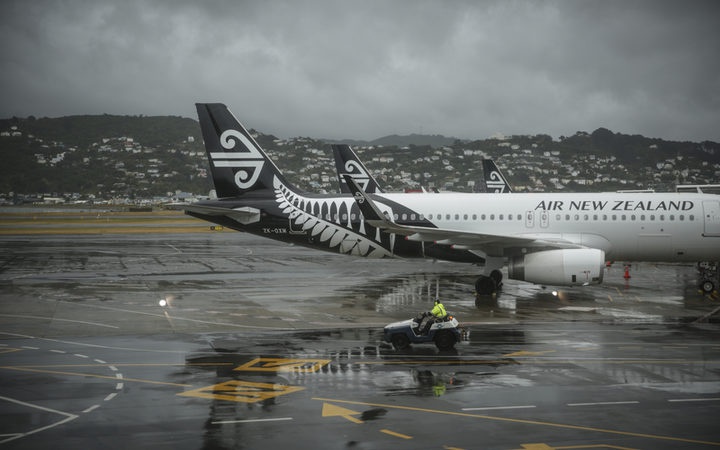 Air NZ airplanes at
an airport