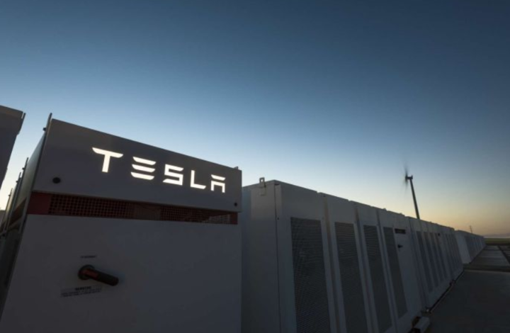 large metal power
unit boxes, on showing TESLA  in glowing letters