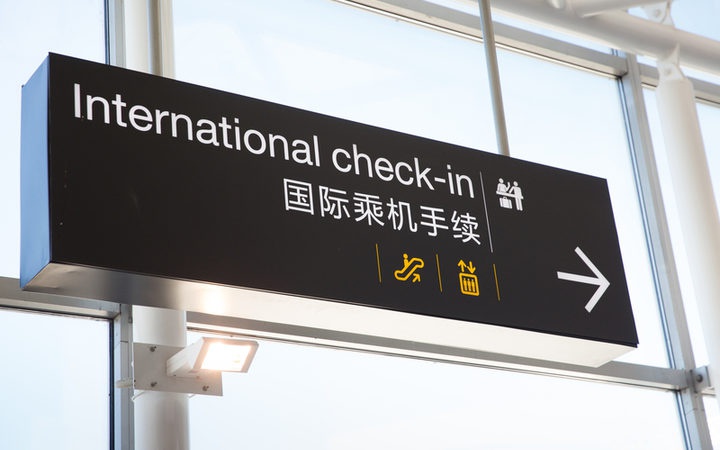 an international
check-in sign at an airport