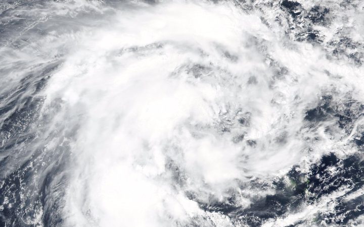 a satellite image
showing a great big swirly cloud system