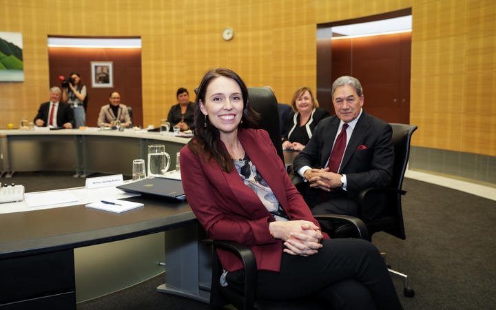 Jacinda Ardern and
other cabinet memembers in the cabinet room