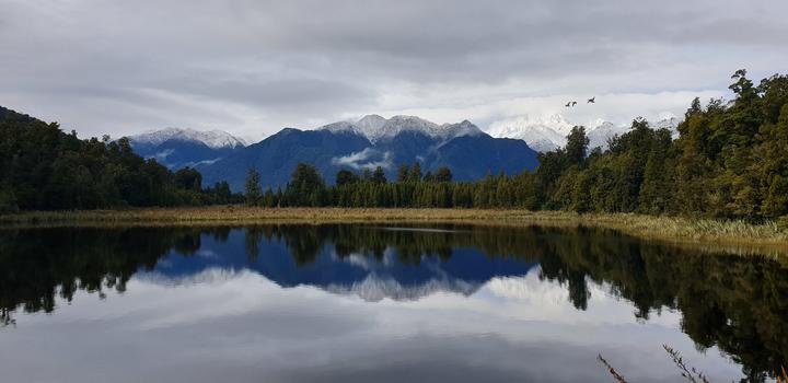 the lake reflecting
the mountains