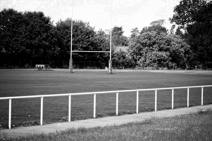 a rugby field and posts with a low steel pipe fence
around the outside