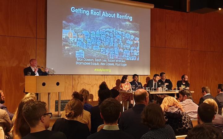 the meeting, a
presenter with a slide saying 'getting real about renting'