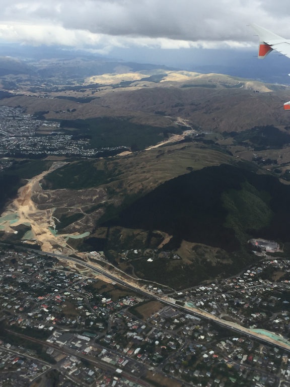 a photo from the
air showing clear dirt amond the hills between areas with
houses