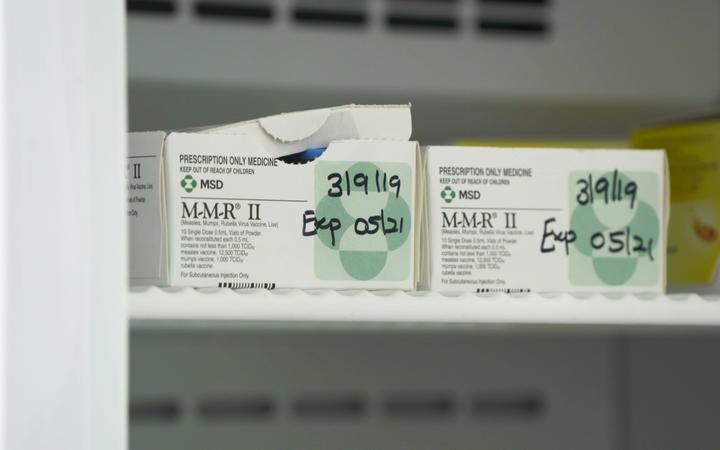 two boxes of MMR
vaccine on a shelf