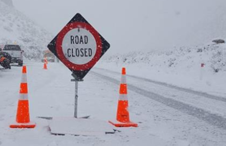 a road closed sign
in snow