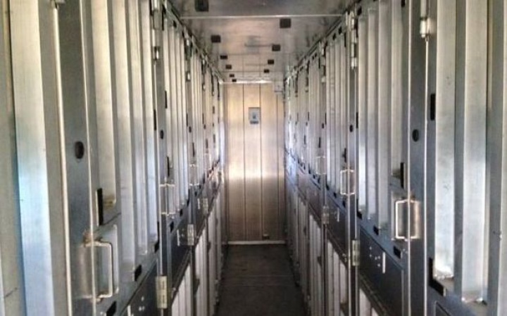 a corridor of metal
doors